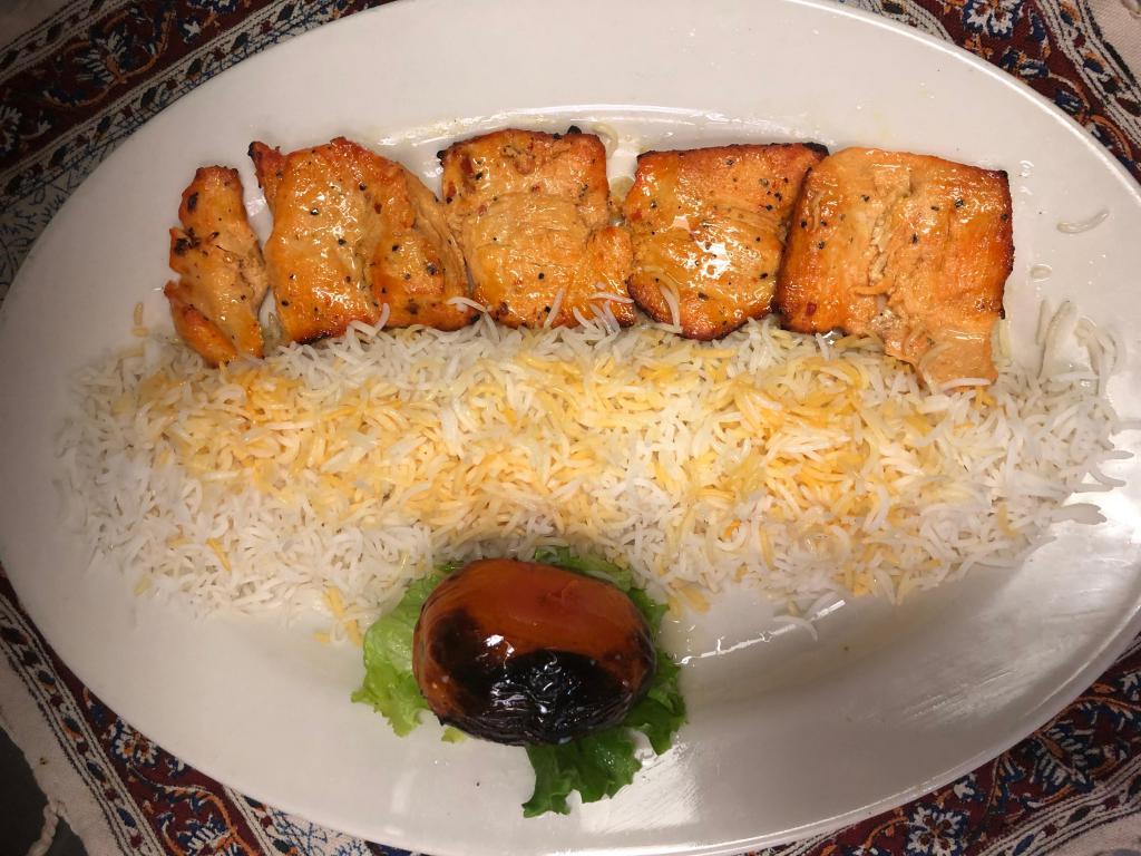 Chicken Chelo Kebab Barg · Marinated and pounded kebab broiled over an open fire. Served with grilled tomato and plan basmati rice chelow.