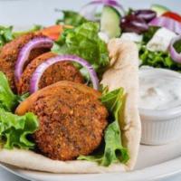 Falafel plate · Served with greek salad and rice