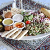 Vegetarian Specialty · Spanakopita, hummus, falafel, dolmas, tabouli salad, Greek salad, tzatziki, and pita bread.
