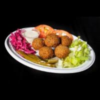 Falafel Veggie Entrée · Croquette of chickpeas served with lettuce, tomatoes, pickles, onions, cucumber and red cabb...