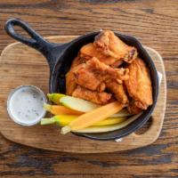 Louisiana Hot Wings · Tri-color carrots, celery, choice of housemade bleu cheese or ranch dressing.