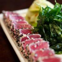 Ahi Tuna Sashimi · Seared rare with pickled cucumber, pickled ginger, wasabi, fried spinach and soy sauce.
