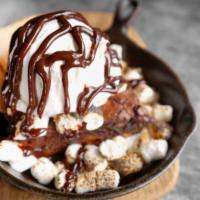S'mores Brownie Pie · Vanilla ice cream, marshmallows, hot fudge, graham crackers.