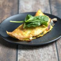 Omelete · Eggs, spinach, feta, prosciutto and basil pesto.