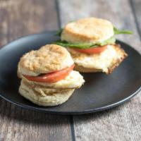 2 Breakfast Sliders · Fried egg on Aunt Thelma’s biscuits with Swiss cheese, tomato, mixed greens and roasted bell...