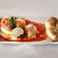 Classic Meatballs · All natural, melted mozzarella and served with garlic bread.