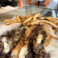 The Philly Sandwich · Sliced grass fed rib eye cheesesteak and American on a housemade baguette. We can substitute...