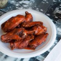 Wings · BONE IN WINGS QITH YOUR CHOICE OF SPICY OR BBQ SAUCE.  SERVED WITH A SIDE OF RANCH DRESSING