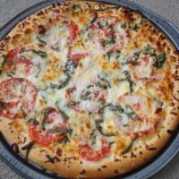 Margherita Pizza · Mozzarella, fresh tomatoes, garlic, and basil.