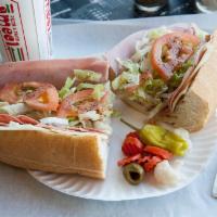 Cold Cut Sub · Mayo, ham, salami, mortadella, provolone cheese, lettuce, tomato and Italian dressing.