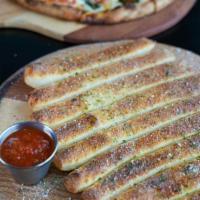 Breadsticks · Handcrafted using our fresh baked dough, sliced into approx 10 pieces, topped with garlic bu...