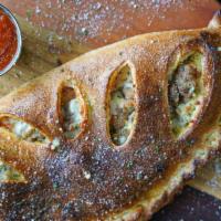 Meatball Calzone · All-beef meatballs, ricotta, whole-milk mozzarella, a hint of our house pizza sauce (served ...