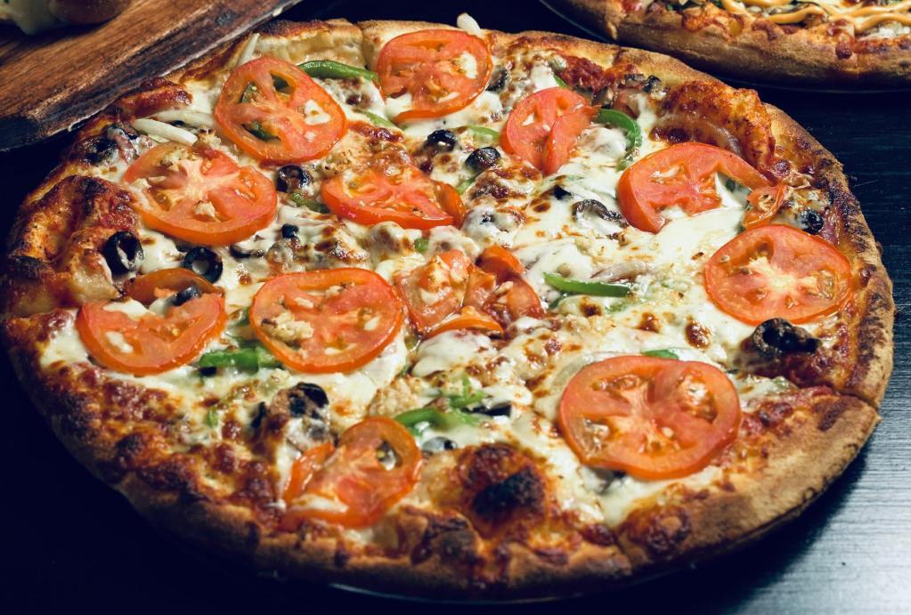 Veggie · Roma tomatoes, mushrooms, onions, green bell peppers, black olives, fresh garlic, whole-milk mozzarella, house pizza sauce