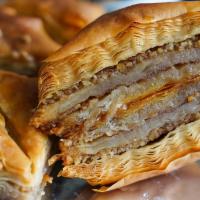 Mama's Baklava · Authentic Mediterranean pastry w/a double layer of crispy, buttery phyllo dough, chopped wal...