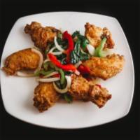 A11. Chicken Wings · 6 pieces. Marinated with garlic butter or fish sauce.