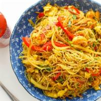 Singapore Noodle · Vermicelli noodles, bell pepper, carrots, onion, snow pea, scallion, and egg in curry powder.
