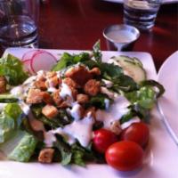 Caesar Salad · Chopped romaine, white anchovies, croutons, house Caesar dressing and Parmesan crisp.