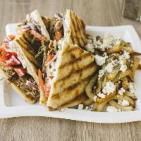 Mega Pita Skepasti · Large Covered pita. Served with your choice of yeero, beef and lamb or chicken, tomato, onio...