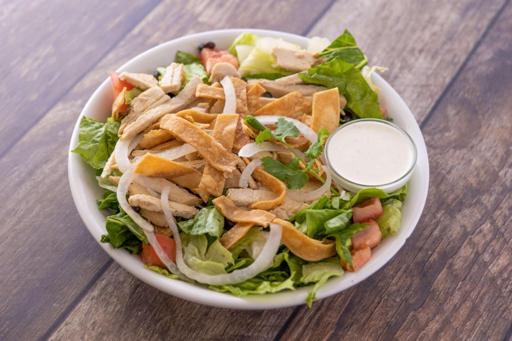 Chicken Mojo Salad · Cuban marinated chicken breast, iceberg and romaine lettuce, tomatoes, onion, black beans, tortilla strips and ranch dressing.