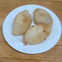 23. Pork Dumpling (3 pieces) · Minced pork wrapped in sweet glutinous rice flour and deep fried. Dumplings look like mini f...