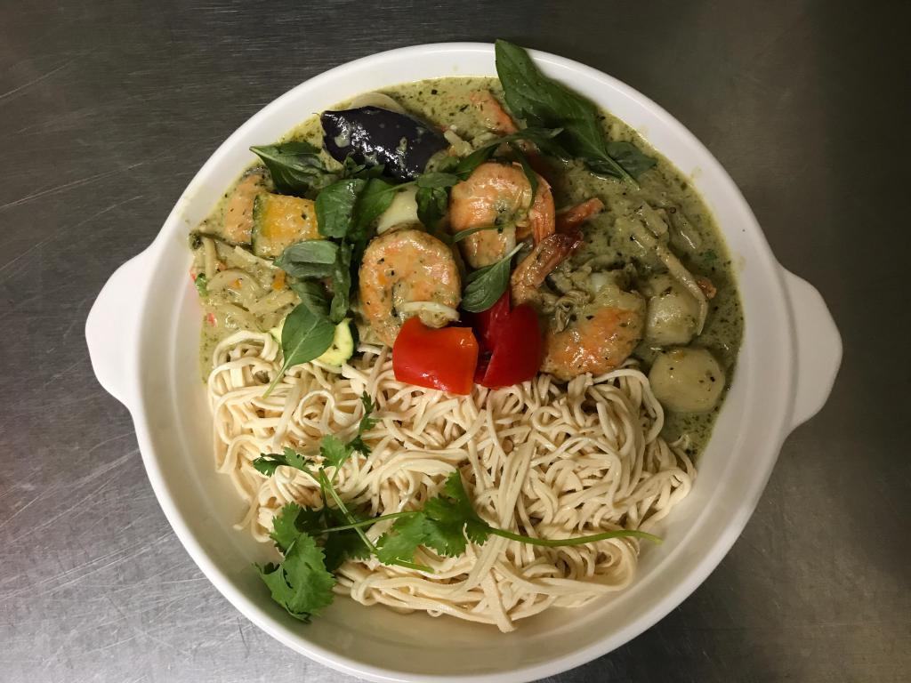 Seafood Green Curry with Soybean Noodles · Coconut green curry with prawns, mussels, calamari, salmon, and fish ball.