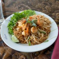 62. Pad Thai · Thin rice noodles stir-fried with your choices of chicken, beef or pork with egg, bean sprou...