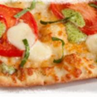 Tomato Pesto Flatbread · Gourmet toppings on a lighter, crispier crust brushed with garlic olive oil and topped with ...