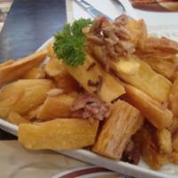 03. Mandioca Com Bacon · Yucca fries with bacon. Small yuccas fried and served with chopped bacon.
