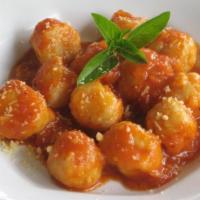 22. Nhoque Recheado · Stuffed gnocchi. A combination of Flour, Milk, oil, and salt cooked with tomato Sauce . Stuf...