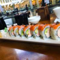 Truffle Salmon Roll · Spicy salmon roll topped with salmon and white truffle oil, micro greens, and sea salt. Wrap...