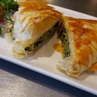 Spanakopita · Spinach and feta cheese baked in phyllo. 