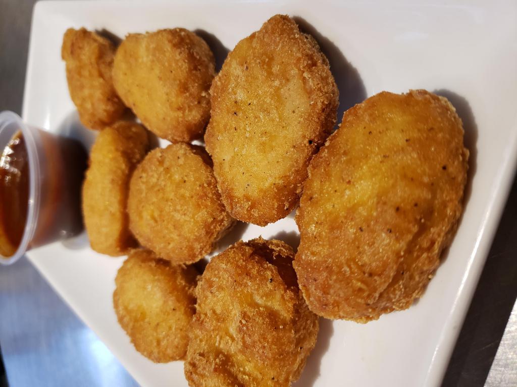 Chicken Nuggets · Crisp battered nuggets served with your choice of dipping sauce