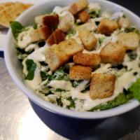 Caesar Salad · Romaine lettuce, seasoned croutons, grated cheese and Caesar dressing. Served with pita bread.