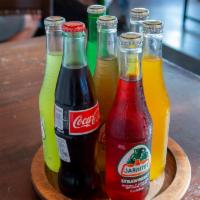 Jarritos · Delicious all natural mexican flavored sodas. Available in Lime, Pineapple, Tamarindo, Fruit...