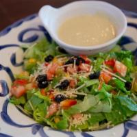 House Salad · Crisp romaine, avocados, red bell peppers, corn, tomatoes, olives, Parmesan cheese and serve...