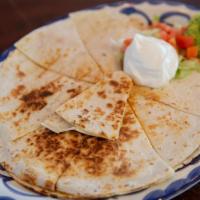 Quesadillas · Crispy choice of flour or corn tortillas, filled with blend of Monterey and cheddar. Chicken...