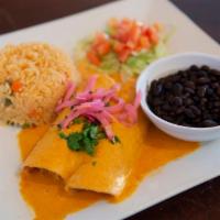 Enchiladas En Salsa de Habanero · 2 hand-made corn tortillas filled with chicken carnitas, finished with a delicious roasted h...