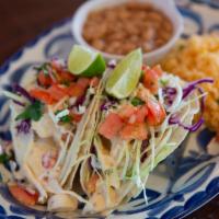 Tacos de Pescado · Hand made corn tortillas, filled with either Chilean Red Snapper or Wild Alaskan halibut wha...