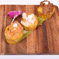 Mofonguito Trio · Fried plantain stuffed with shrimp, chicken and beef.