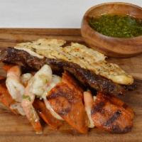 La Bella Tasting · An assortment of grilled skirt steak, chicken breast, chorizo and shrimp and served with mix...