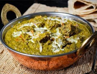 Lamb Sag · Boneless chunks of lamb in a delicately spiced spinach sauce, comes with rice
