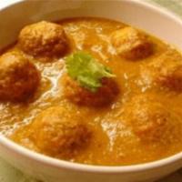 Malai Kofta · Mixed vegetable rolls cooked in a creamy almond sauce. Served with rice.