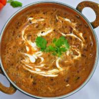 Dal Makhani · Three kinds of lentils cooked overnight, sizzling with onion, garlic, tomato and lots of her...