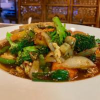 70. Pad Pik Pao · Yellow onion slices, fresh mushroom, bell pepper, carrot, broccoli and green onion with swee...
