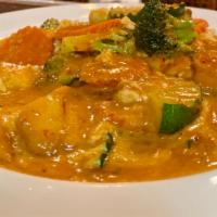 73. Red Curry · Red curry sauce with bamboo shoot, carrot, fresh mushrooms, broccoli, bell pepper and basil....