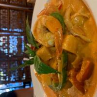 78. Pineapple Shrimp Curry · Pineapple, bamboo shoot, bell pepper, carrot and tomato with a blend of Thai spices in a coc...