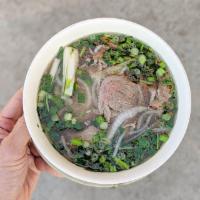 P2. Pho Tai Filet Mignon Soup · Rice noodle soup with sliced filet mignon steak with beef broth served with rice noodles top...