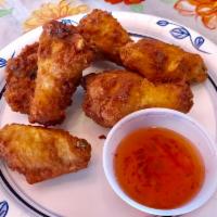 Thai Wings ปีกไก่ทอด · Fried chicken wings with sweet chili sauce.