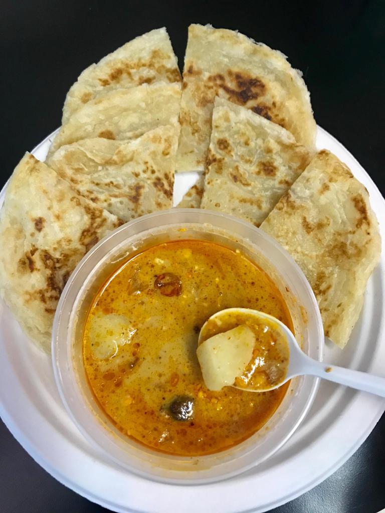 Roti Canai · Roti flatbread served with potatoes massaman curry dipping sauce. Vegan. Spicy.