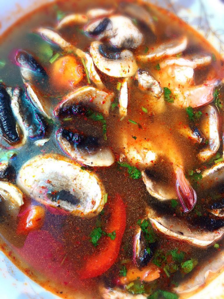 Tom Yum Soup · Spicy lemongrass broth with mushrooms and galangal. Spicy.